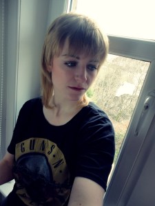 me, pensive on windowsill
