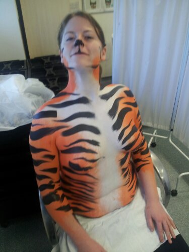 It will obviously be, uh, finished on the day of the assessment.  Ie her face will be painted, her hair will be done, the photo submitted will be all styled and shit.